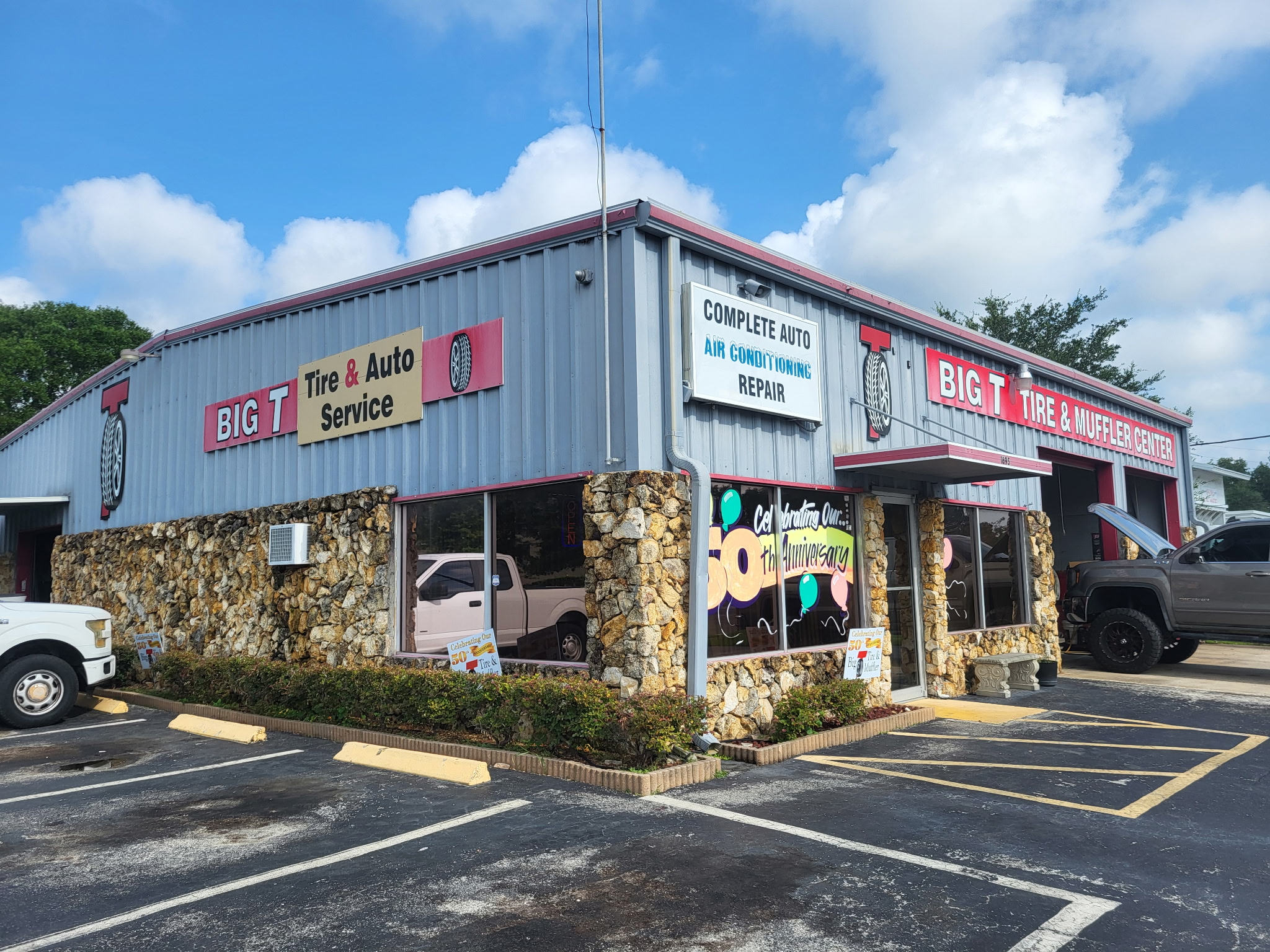 Corner view of Big T Tire and Muffler Center building